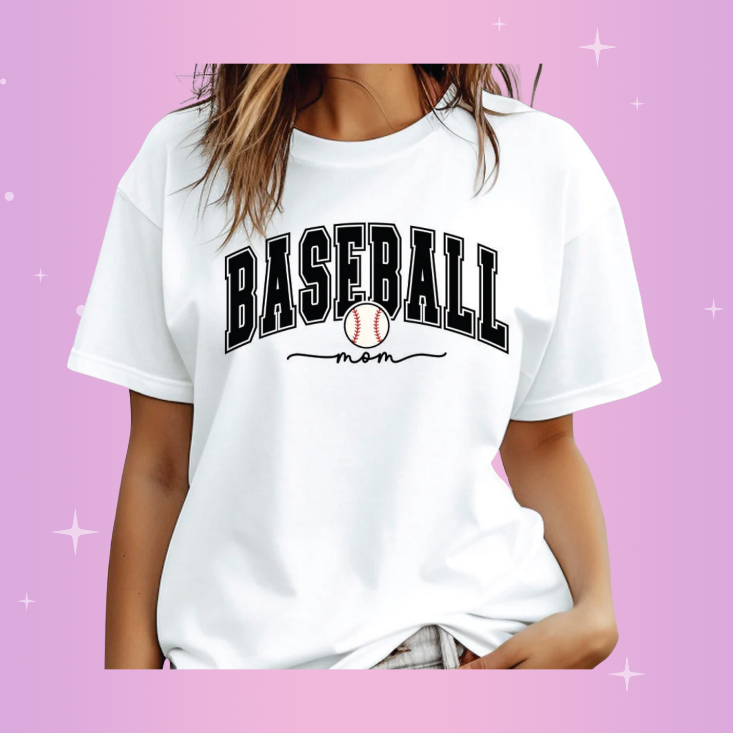 A woman wearing a white t-shirt with the text 'BASEBALL' on it, against a pink background.