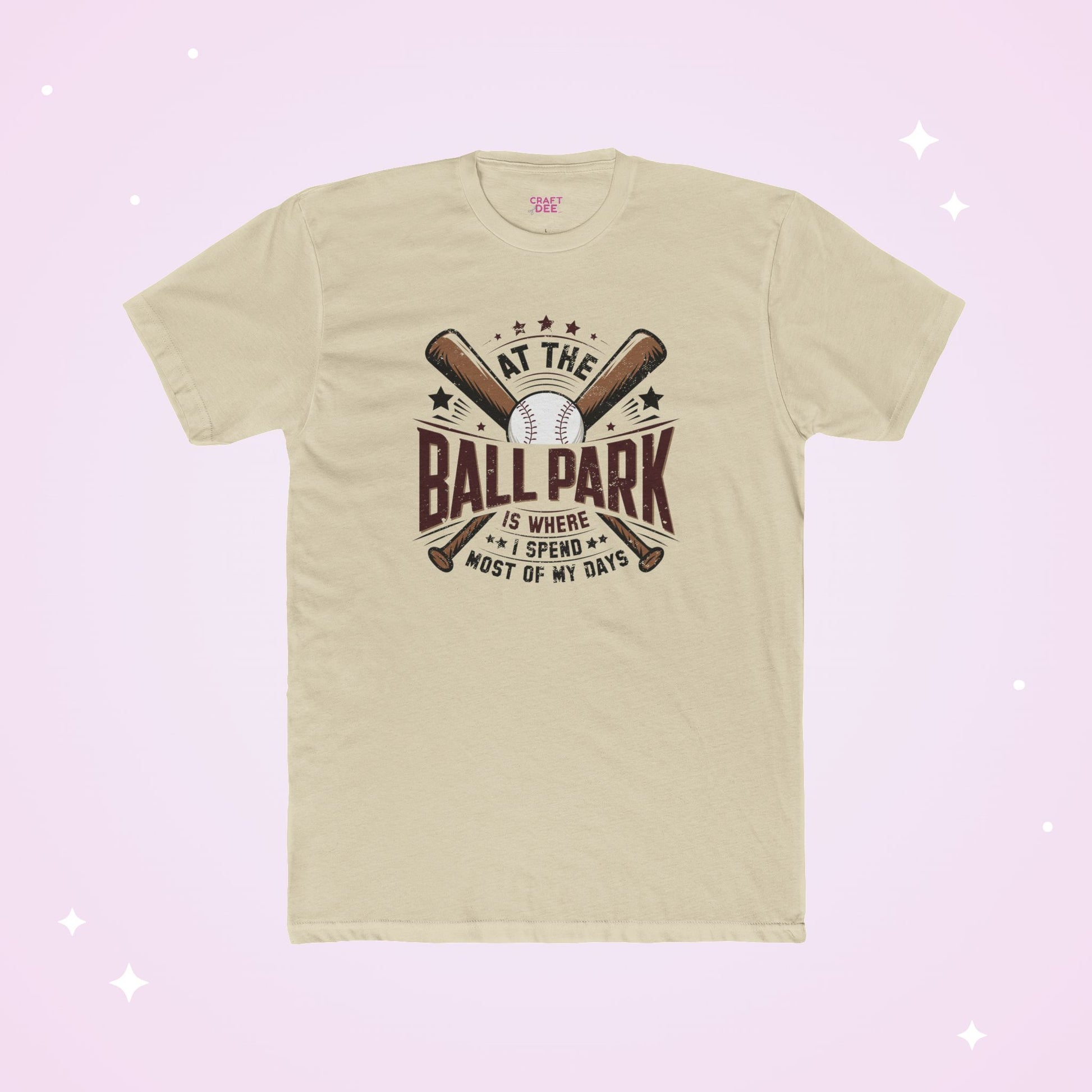 Beige t-shirt with baseball graphic and text on a light purple background