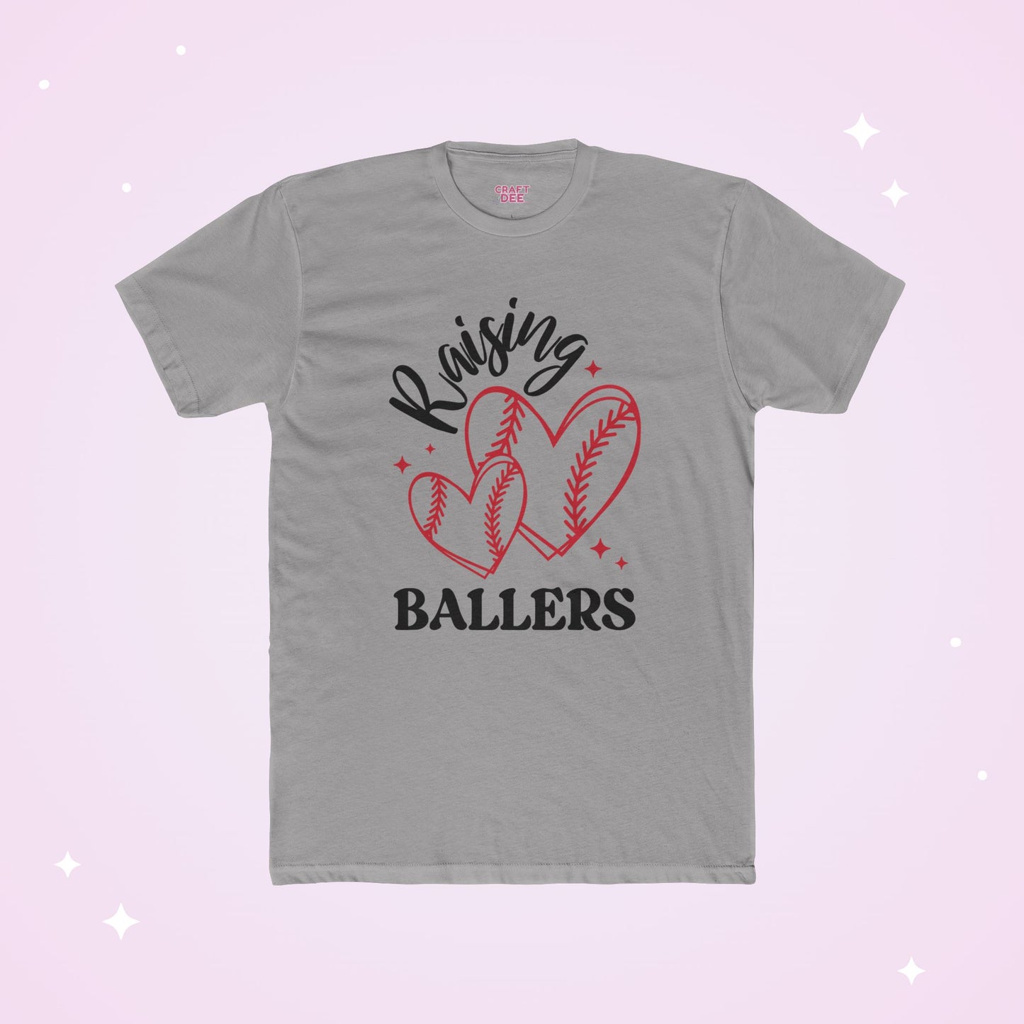 Gray t-shirt with 'Raising Ballers' text and heart-shaped baseballs on a light pink background