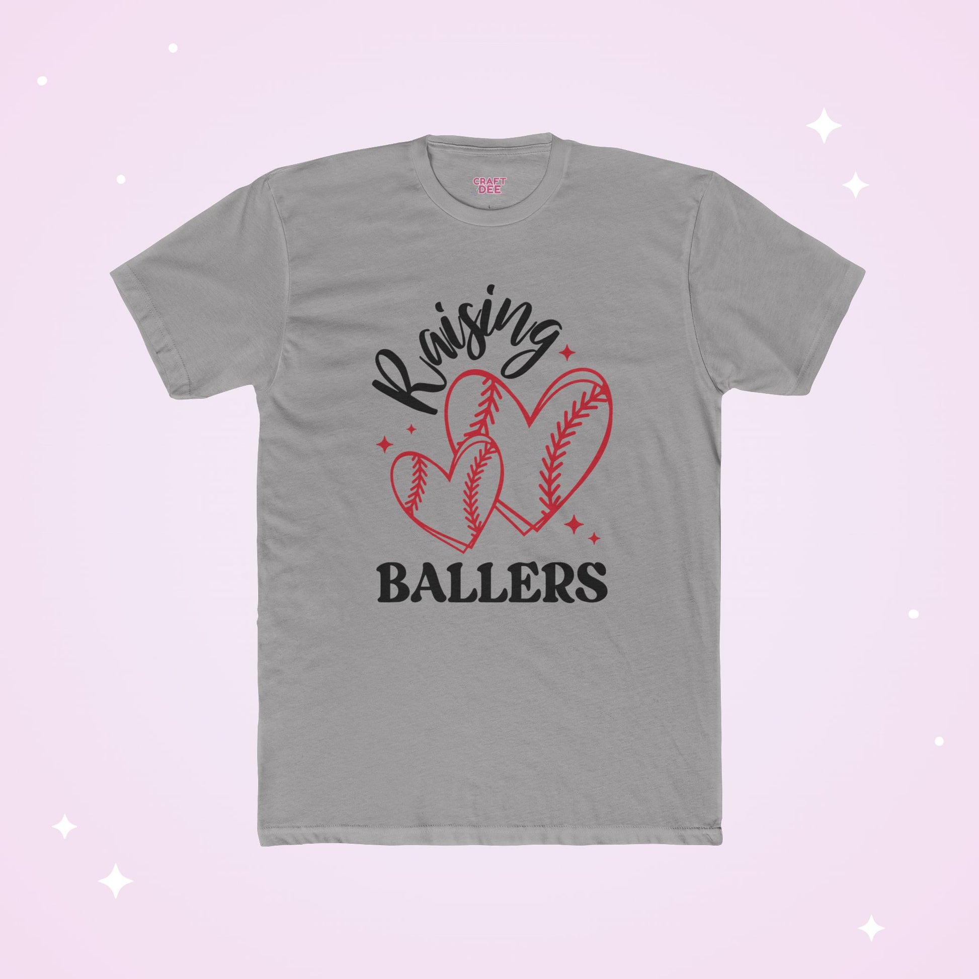 Gray t-shirt with 'Raising Ballers' text and heart-shaped baseballs on a light pink background