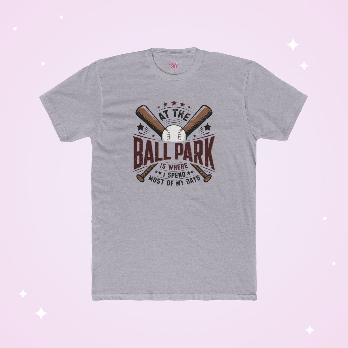 Gray t-shirt with baseball-themed design on a light purple background