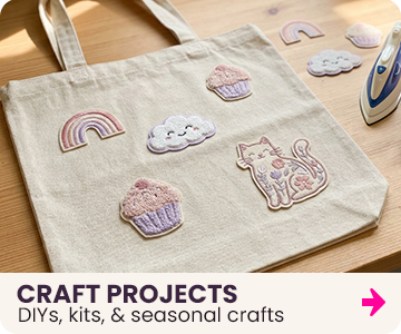 Beige tote bag with embroidered patches on a wooden surface, with text 'Craft Projects, DIYs, kits, & seasonal crafts'.